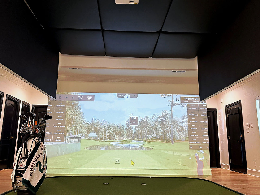 Motorized golf simulator screens partway through retracting into the ceiling